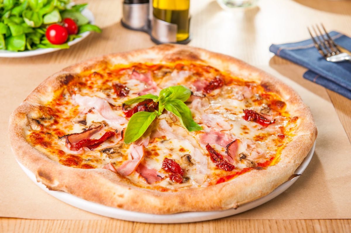 Découvrez le secret d'une pâte à pizza maison à la fois croustillante et moelleuse